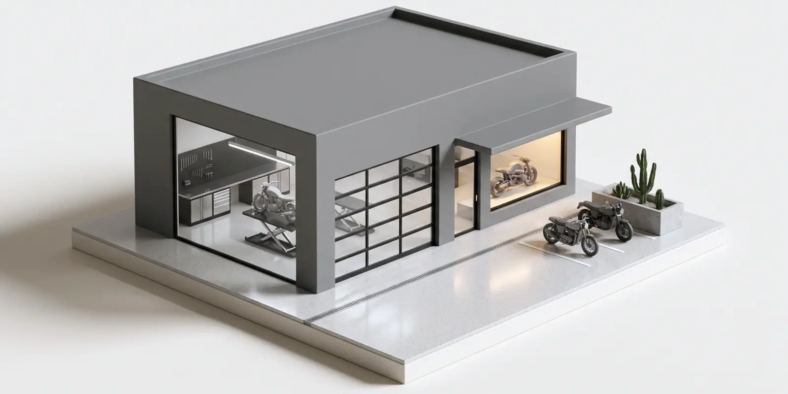 Maqueta a escala del local de un taller: las motos en el patio y la herramienta adentro.